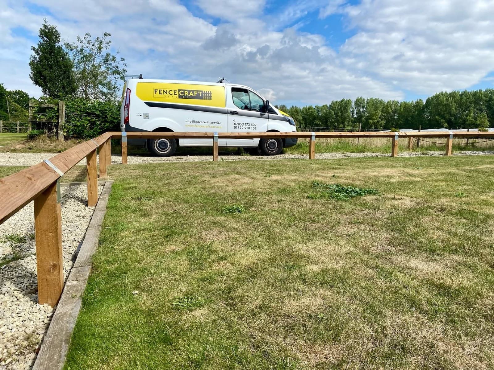 The Fencecraft Services van beside a newly built post-and-rail fence on a Kent field