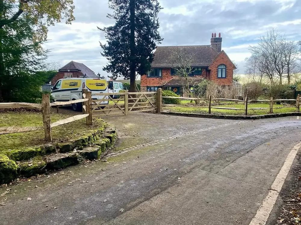 Chestnut post & 2-rail with palisade and a field gate