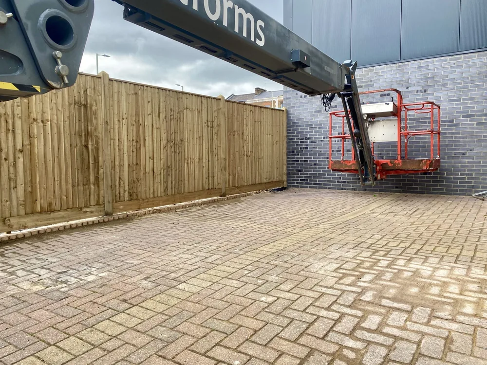 Closeboard fencing installed alongside a commercial unit